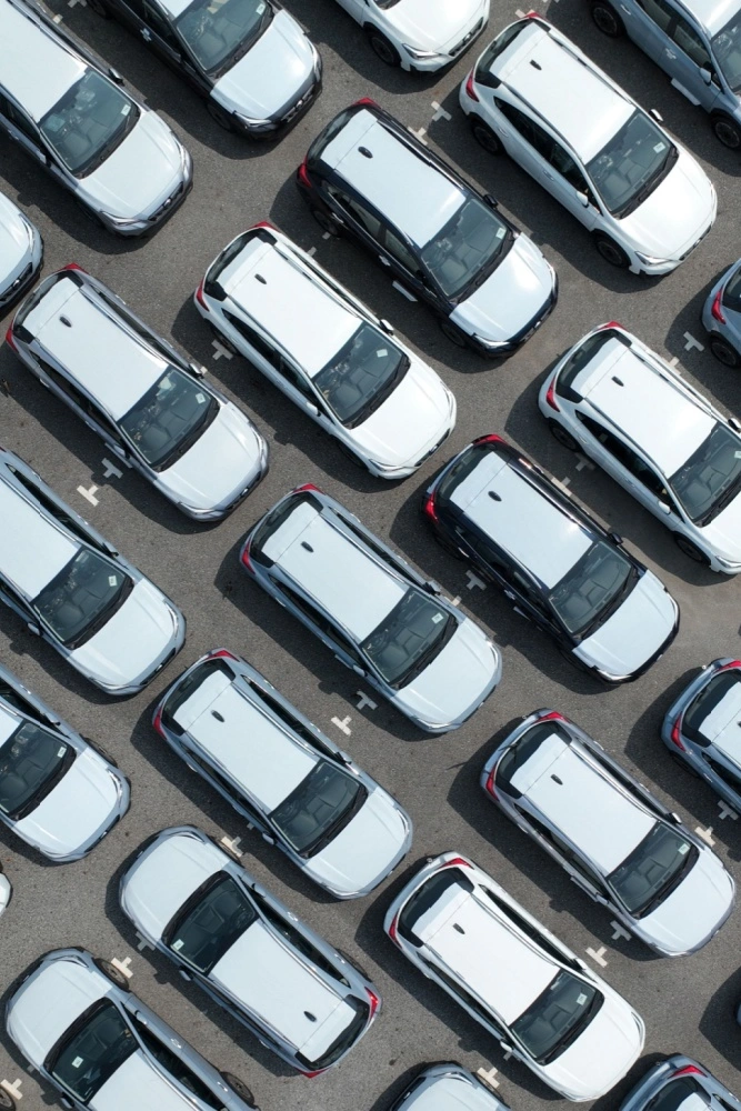 Parking Lot Security Systems by LiveView Tech Top view of parked cars in a dealership lot, secured with LVT's parking lot surveillance solutions
