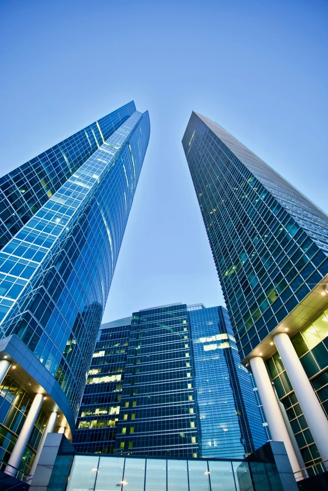 LVT Security Solutions for Commercial Buildings Skyscrapers in a commercial district, showcasing the potential for LVT's tailored security camera integrations
